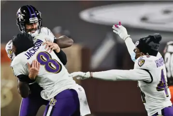  ?? Associated Press ?? ■ Baltimore Ravens quarterbac­k Lamar Jackson (8) celebrates with kicker Justin Tucker (9) after Tucker kicked a field goal during the second half against the Cleveland Browns on Monday in Cleveland. The Ravens won, 47-42.