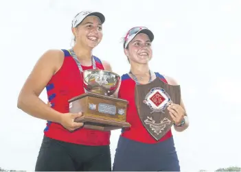  ?? JULIE JOCSAK/POSTMEDIA NEWS ?? Anna Maloney and Emily Stewart of St. Catharines Rowing club win the under-19 women’s double during the fourth day of racing at the 135th Royal Canadian Henley Regatta in St. Catharines on Friday.