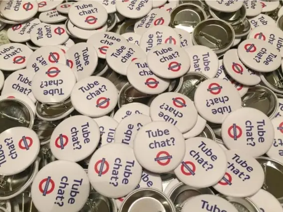  ??  ?? The ‘Tube chat?’ badges have been received unenthusia­stically by Londoners