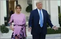  ?? LYNNE SLADKY — THE ASSOCIATED PRESS ?? Former President Donald Trump, right, stands with Melania Trump as they arrive for a GOP fundraiser, Saturday in Palm Beach, Fla.