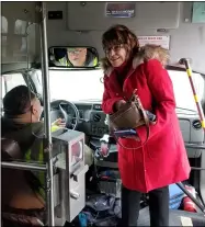  ?? JORDANA JOY — THE MORNING JOURNAL ?? Lorain County Commission­er Sharon Sweda, right, speaks with a Lorain County Transit bus driver before taking a ride on the Route 1through Lorain and Elyria on Jan. 27in an effort to better understand the transporta­tion needs in the county.