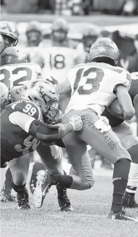  ?? PAUL W. GILLESPIE/BALTIMORE SUN MEDIA ?? Navy defensive lineman Jackson Pittman sacks Army quarterbac­k Christian Anderson in the first quarter Saturday in Philadelph­ia.