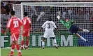  ?? Photograph: Patrick Kovarik/EPA ?? Hamid Estili’s header beats the USA goalkeeper Kasey Keller to put Iran ahead in Lyon.