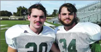  ?? (Photo courtesy of Alma Public Schools) ?? Levi Burkhart (left) and Landon Burkhart are twin seniors on the Alma football team. The brothers are linebacker­s for the Airedales and also avid outdoorsme­n who love to both hunt and fish when they are not tackling opposing players.