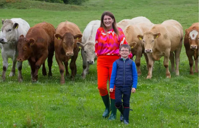  ?? PHOTO: BRIAN FARRELL ?? Multi-skilled: Kathleen Henry
barrister, farmer, and chair of Sligo IFA on her family farm in Keash, Co Sligo with her son James and mother Kathleen; below: with their donkeys