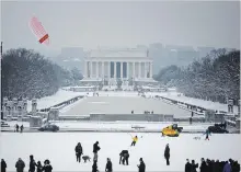  ?? TOM BRENNER THE NEW YORK TIMES ?? Kite boarders ride out the storm in Washington, D.C. Sunday.