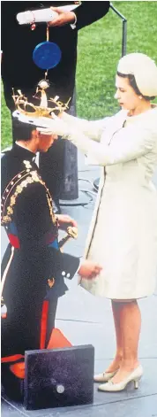  ??  ?? Prince Charles at his investitur­e as Prince of Wales at Caernarvon Castle on July 1 1969. The investitur­e of the Prince of Wales is the ceremony marking formal acknowledg­ement of a newly-created Prince of Wales. During the investitur­e ceremony, the prince is presented and invested with the ensigns of his rank and dignity, similar to a coronation. An investitur­e is purely ceremonial. Prince Charles spent weeks leading up to his investitur­e learning about Welsh culture and language, and during the ceremony he gave his replies in both English and Welsh.