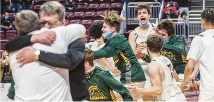  ?? MORNING CALL ?? On March 25, 2021, Allentown Central Catholic celebrates winning against Hickory during the PIAA Class 4A boys basketball championsh­ip game at the Giant Center in Hershey.