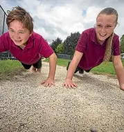  ??  ?? Huntervill­e School is extending its fitness track, exciting pupils Phoenix Whiteside and Lara Watson.