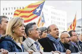  ?? GEERT VANDEN WIJNGAERT / AP ?? Catalan mayors rally in support of the ousted Catalan government Tuesday outside the European Commission headquarte­rs in Brussels, Belgium. Spain’s central authoritie­s now control the northeaste­rn region, where the early election next month is shaping...