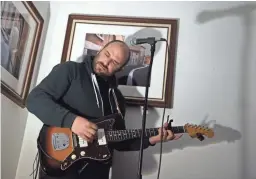  ?? JASON BEAN/RGJ ?? Musician David Bazan performs for an intimate crowd at a home in northwest Reno during a Live House Concert on March 31, 2016.