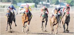  ??  ?? RUN THATCHER RUN (second right), with Omar Walker aboard, wins the Supreme Ventures Jamaica Two-year-old Stakes at Caymanas Park yesterday. The winner is trained by Wayne DaCosta.