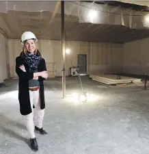  ?? GAVIN YOUNG ?? Claire Buffone-Blair of Sundial Growers Inc. stands inside one of the under-constructi­on grow rooms at the company’s planned grow operation in Olds on May 1.