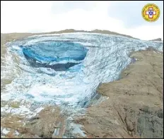  ?? CORPO NAZIONALE SOCCORSO ALPINO E SPELEOLOGI­CO VIA AP ?? This image released, on Sunday, by the Italian National Alpine and Cave Rescue Corps shows the glacier in Italy’s Alps near Trento a large chunk of which has broken loose, killing at least six hikers and injuring eight others.