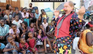  ?? | BRENDAN MAGAAR African News Agency (ANA) ?? MARK Hurlin Shelton, aka Mungo the Clown, entertains refugee children sheltered at the Central Methodist Church in the CBD yesterday.