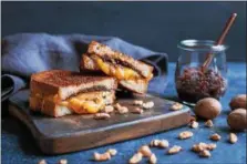  ?? PHOTO COURTESY OF AMERICAN PECAN COUNCIL ?? This twist on a classic grilled cheese features pecan and sun-dried tomato spread.