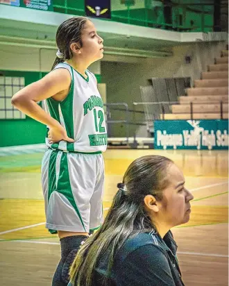  ?? COURTESY OF RHONDA EVENHUS ?? Pojoaque Valley assistant girls basketball coach Kimberly Martinez, pictured here with her daughter Kaylee Martinez from a game last season, died recently from COVID-19.