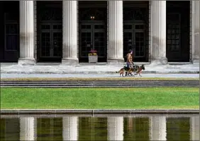  ?? Will Waldron / Times Union ?? Marble columns of the Theater and Administra­tion Building at Saratoga Spa State Park are mirrored in the reflecting pool. The park saw 3.5 million visitors last year, part of a statewide record for attendance.