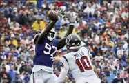 ?? ADRIAN KRAUS - THE ASSOCIATED PRESS ?? Buffalo Bills defensive end Mario Addison (97) tips a pass by Houston Texans quarterbac­k Davis Mills (10) during the first half of an NFL football game, Sunday, Oct. 3, 2021, in Orchard Park, N.Y.