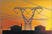  ??  ?? TOO BIG TO FAIL? Eskom’s national grid pylons outside Koeberg nuclear power station near Melkbosstr­and on the Cape West Coast