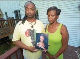 ?? DIGITAL FIRST MEDIA FILE PHOTO ?? Rodney and Michelle Roberson hold a photo of their daughter, Bianca Nikol Roberson.