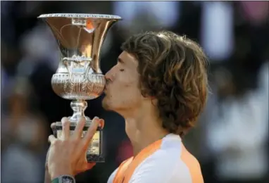  ?? GREGORIO BORGIA — THE ASSOCIATED PRESS ?? Germany’s Alexander Zverev kisses the trophy after winning his final match against Serbia’s Novak Djokovic at the Italian Open tennis tournament, in Rome, Sunday.