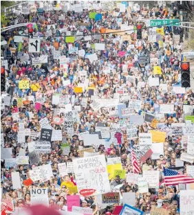  ?? Pictures / AP ?? Tens of thousands of teenagers took the the streets of the Unites States at the weekend, including in Atlanta, to call for stricter gun laws.