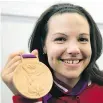  ?? THE CANADIAN PRESS ?? The two women who beat Christine Girard, pictured with her bronze medal, have subsequent­ly failed drug tests.