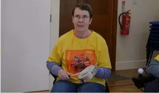  ?? ?? A woman in a samba drum class for people with Parkinson's disease.