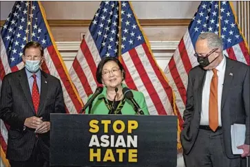  ?? Kent Nishimura Los Angeles Times ?? SEN. MAZIE HIRONO speaks after her bill’s passage. With her are Sen. Richard Blumenthal, left, and Majority Leader Charles Schumer, who called the vote proof that “the Senate can work to solve important issues.”