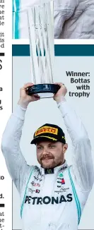  ??  ?? Winner: Bottas with trophy