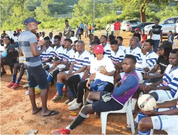  ??  ?? Team talk . . . A coach gives a motivation­al team talk before one of the matches.