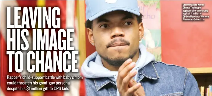  ??  ?? Grammy Award winner Chance The Rapper applauds after announcing a gift of $ 1 million to CPS on Monday at Westcott Elementary School.
| AP
