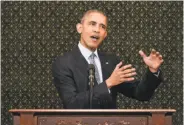  ?? Mandel Ngan / AFP / Getty Images ?? President Obama addresses the Illinois General Assembly at the State Capitol in Springfiel­d.