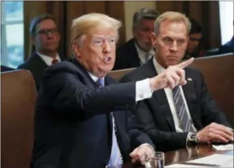  ?? PABLO MARTINEZ MONSIVAIS — THE ASSOCIATED PRESS ?? President Donald Trump gestures while speaking during his meeting with members of his cabinet in Cabinet Room of the White House in Washington, Wednesday. Looking on is Deputy Secretary of Defense Patrick Shanahan.