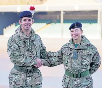  ?? ?? HANDOVER: Lt Col Shamus Kelly congratula­tes his wife Lt Col Lyndsey Kelly.