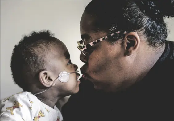  ?? AP PHOTO/BUTCH DILL ?? Curtis Means kisses his mother, Michelle Butler at their home in Eutaw, Ala., on March 23.