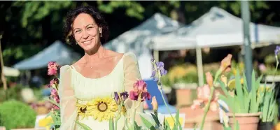  ??  ?? Turismo floreale Cristina Mostosi a Orticola (foto Furlan/ Lapresse). Il suo Giardino di Trebecco (Bergamo) organizza eventi per il pubblico