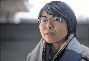  ?? CP PHOTO ?? Vivian Ly, who is autistic, sits for a photograph during a break from classes at Simon Fraser University in Burnaby, B.C., on Friday.