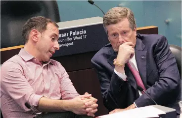  ?? CHRIS YOUNG / THE CANADIAN PRESS ?? Toronto Mayor John Tory, right, sits with Councillor Josh Matlow on Thursday as council discusses provincial legislatio­n to reduce the size of Toronto city council.