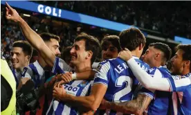  ?? Photograph: Javier Etxezarret­a/EPA ?? Mikel Oyarzabal celebrates after scoring from the spot to round off Real Sociedad’s 3-1 win against Athletic Club.