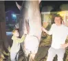  ?? COURTESY ?? Zeke VanFleet, left, and his father, Josiah VanFleet, caught a 9 ½ foot bluefin tuna on Feb. 24 off the coast from Nags Head.