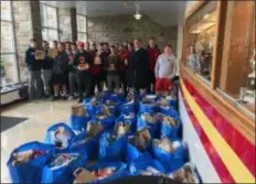  ?? SUBMITTED PHOTO ?? The Haverford High School Fords football team and their boosters held their annual Thanksgivi­ng basket food drive last week. They collected enough donations to create over thirty complete food baskets that included turkeys to give to Philadelph­ia’s Project H.O.M.E.