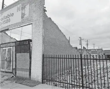  ?? [PHOTO BY STEVE LACKMEYER, THE OKLAHOMAN] ?? The property at 631 W California in Film Row was set to be redevelope­d for a law firm, but after Saturday’s storms toppled the walls, it has been deemed beyond salvaging.