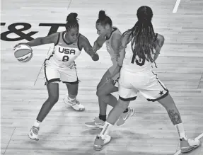  ?? STEPHEN R. SYLVANIE/USA TODAY ?? Sylvia Fowles sets the pick on Brionna Jones (42) as teammate Chelsea Gray (8) advances the ball during the WNBA All Star Game.