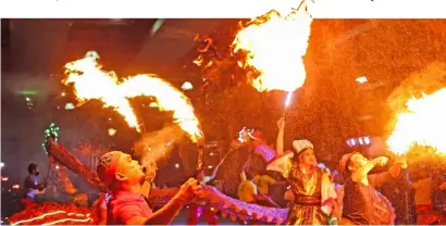  ?? PHOTOGRAPH BY RIO DELUVIO FOR THE DAILY TRIBUNE @tribunephl_rio ?? A ‘FIRE breather’ performs as part of a Lion and Dragon dance during the celebratio­n of Chinese New Year in a Quezon City mall on Sunday.