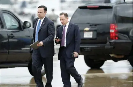  ?? ALEX BRANDON — THE ASSOCIATED PRESS ?? White House Director of Social Media Dan Scavino, left, walks with former White House Chief of Staff Reince Priebus after stepping off Air Force One as they arrive Friday at Andrews Air Force Base, Md. Trump says Homeland Secretary John Kelly is his...