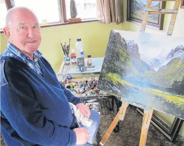  ?? PHOTO: PAM JONES ?? The great outdoors . . . Alexandra artist Denis Kent works on a painting in his home studio. Kent, whose artworks have been sold around the world, has been contributi­ng pieces to the Central Otago Art Society’s Alexandra Blossom Festival Exhibition for...