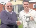  ??  ?? Widnes CC first XI skipper Chris Kirby (right) is presented with the Vivio Cheshire County Cricket League Second Division trophy by league chairman David Humpage.