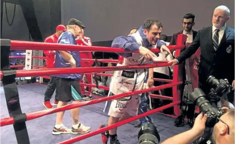  ?? JOHN LAW / NIAGARA FALLS REVIEW ?? Niagara Falls boxer Phil Lo Greco chats with fans and media after his victory at the sold-out Scotiabank Convention Centre Friday night. Promoter Les Woods says more boxing is on the way.